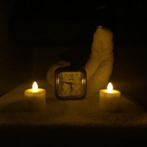 Massage Time! A clock with two candles and a towel dove at the Sanitas Spa at Otel Bilkent in Turkey where I had a massage with the Jonas Brothers